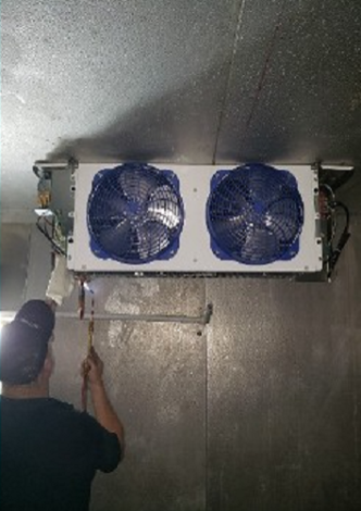 Man Repairing Air Conditioner Fan & Pipe