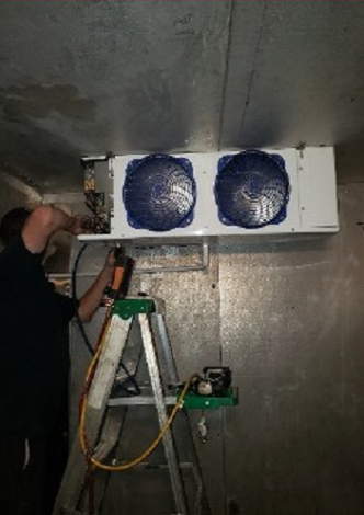 Man Repairing Air Conditioner Fan
